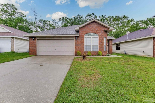 single story home with concrete driveway, a front yard, brick siding, and an attached garage