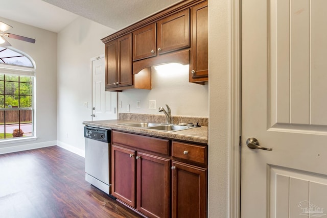 kitchen featuring dark wood-style flooring, baseboards, a ceiling fan, stainless steel dishwasher, and a sink