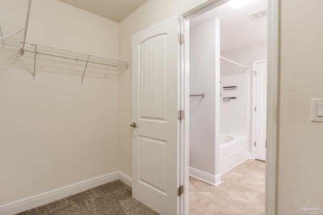 walk in closet with visible vents