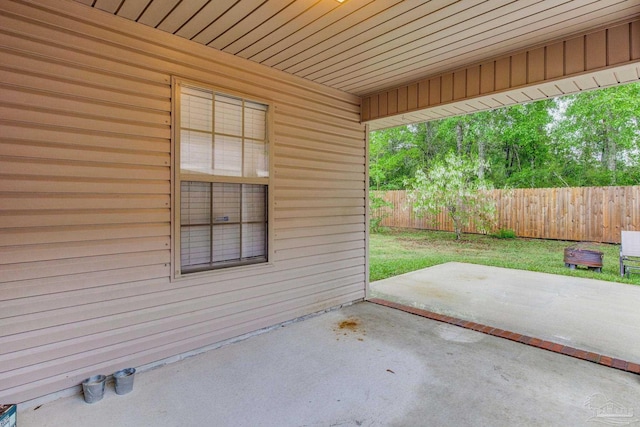 view of patio featuring fence