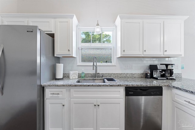 kitchen with white cabinets, stainless steel appliances, and sink