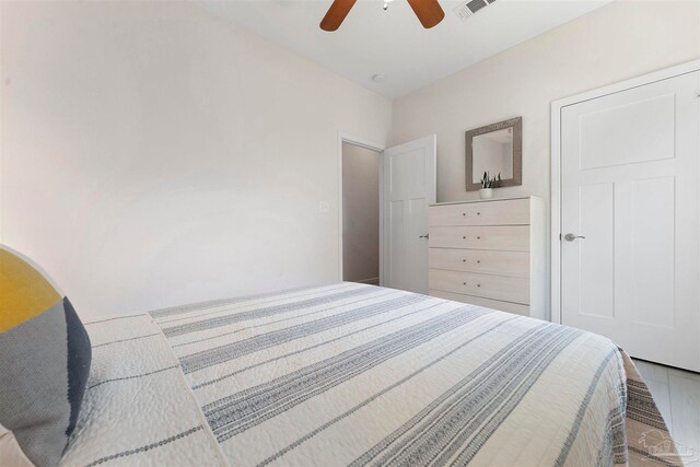 bedroom featuring hardwood / wood-style flooring and ceiling fan