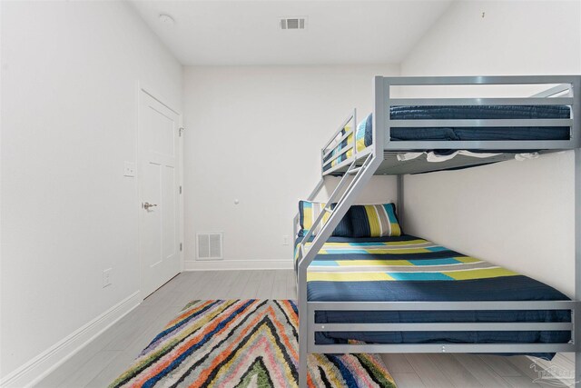 bedroom with light hardwood / wood-style floors