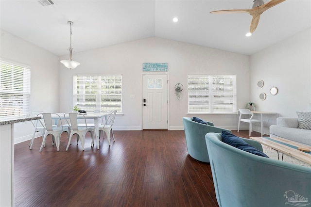 living room featuring vaulted ceiling, dark hardwood / wood-style flooring, and ceiling fan