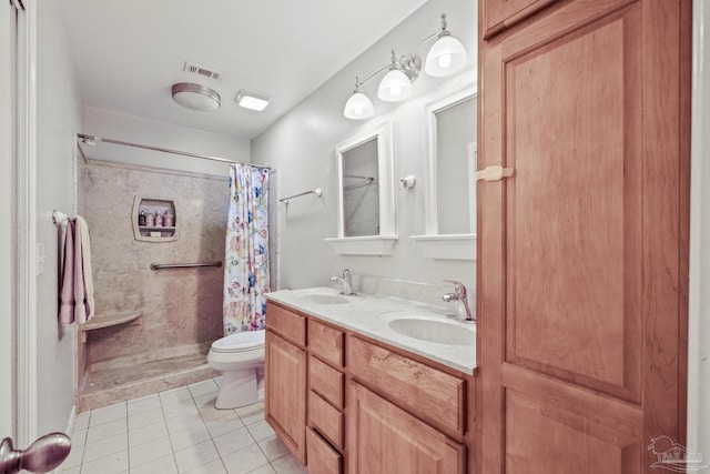 bathroom with walk in shower, vanity, toilet, and tile patterned flooring