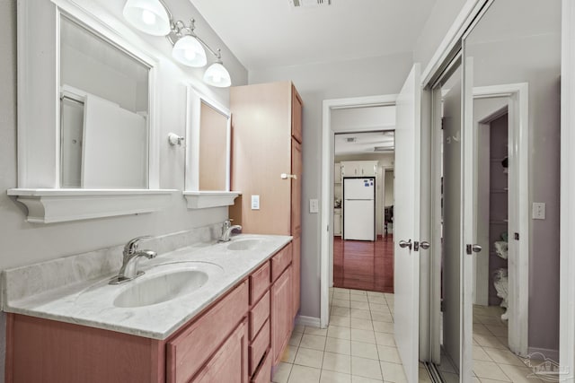 bathroom with vanity and tile patterned floors