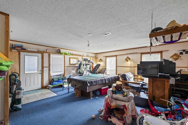 game room featuring light carpet, billiards, and a textured ceiling