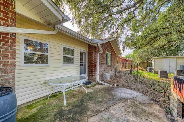 view of patio with a shed