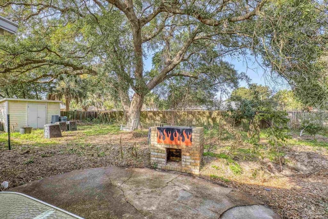 view of yard with a patio area and a shed
