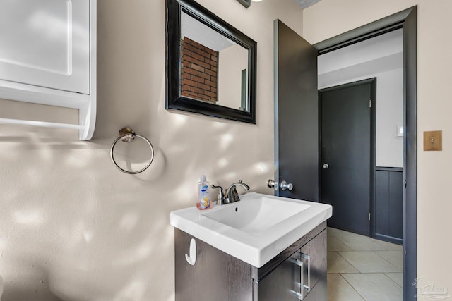 bathroom with tile patterned flooring and vanity