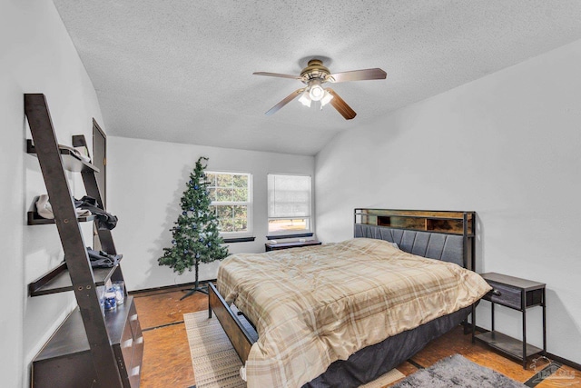 bedroom with baseboards, a textured ceiling, and a ceiling fan