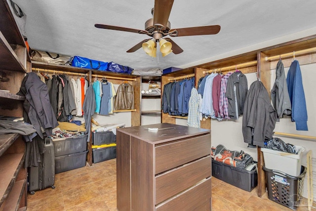 spacious closet with a ceiling fan