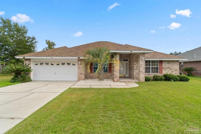 ranch-style house featuring a garage and a front yard