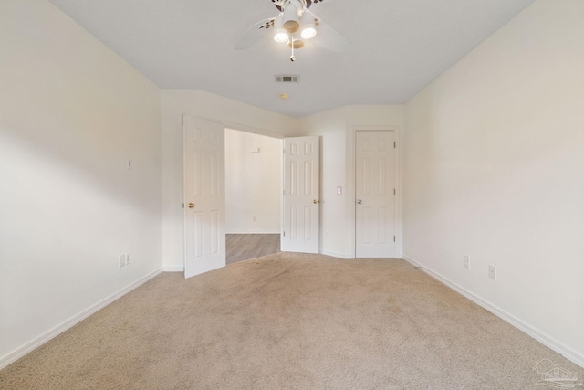 unfurnished bedroom with light carpet and ceiling fan