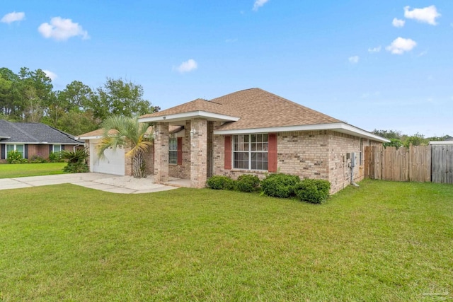 ranch-style home featuring a garage and a front yard