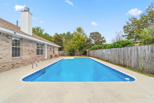 view of pool featuring a patio area