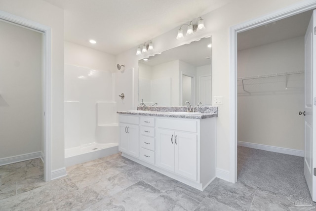 bathroom featuring vanity and walk in shower