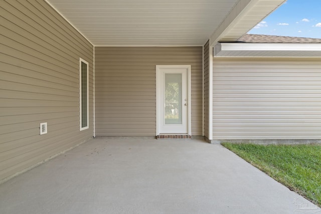 entrance to property featuring a patio area