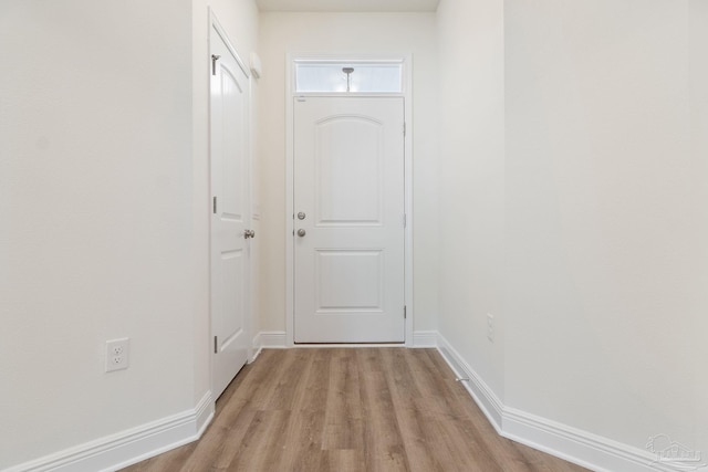 entryway with light hardwood / wood-style floors