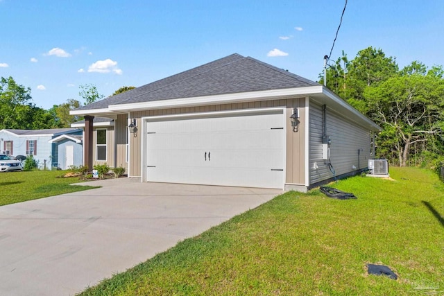 ranch-style home with a garage, central AC unit, and a front lawn