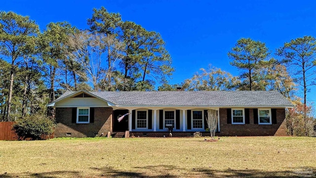 ranch-style home with a front lawn, brick siding, and crawl space