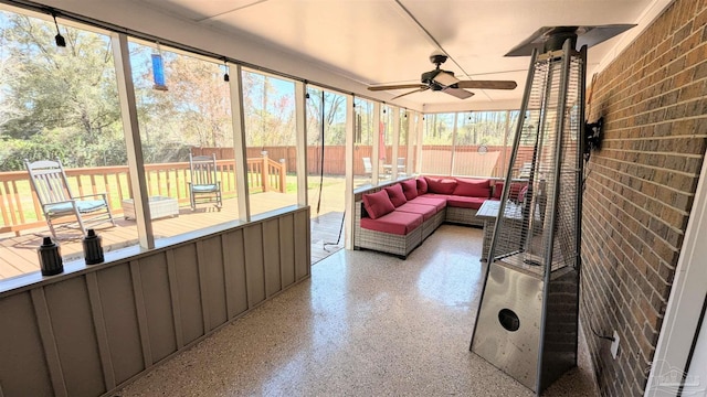 sunroom with ceiling fan