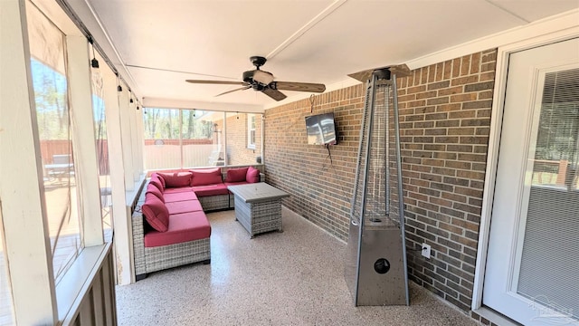 sunroom with a ceiling fan