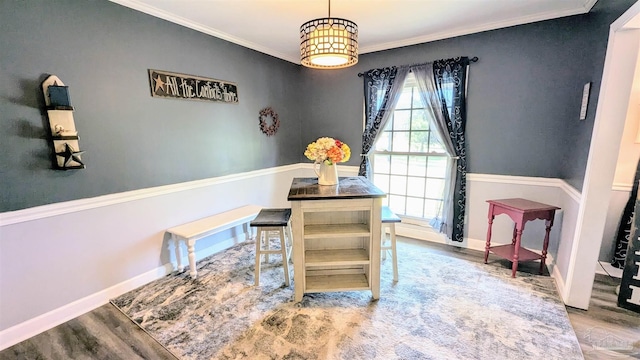 office area with baseboards, wood finished floors, and crown molding