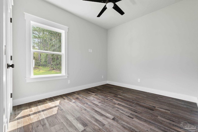 empty room featuring ceiling fan, a healthy amount of sunlight, and hardwood / wood-style flooring