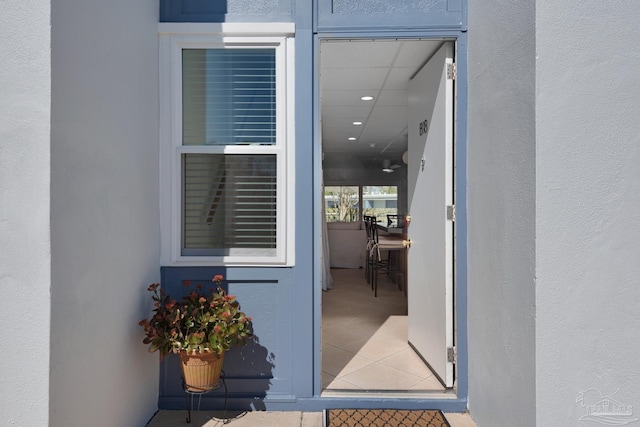 doorway to property with stucco siding