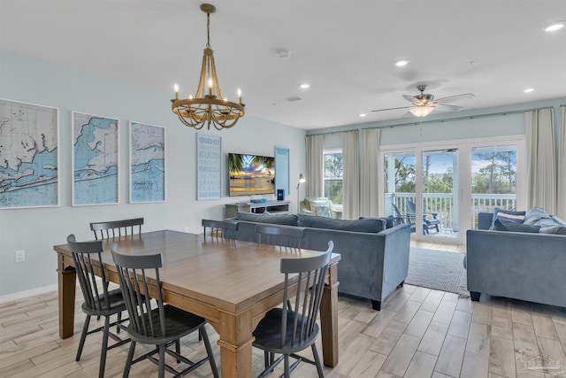 dining area featuring ceiling fan with notable chandelier, wood tiled floor, baseboards, and recessed lighting