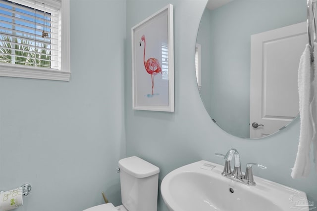 bathroom featuring toilet and a sink