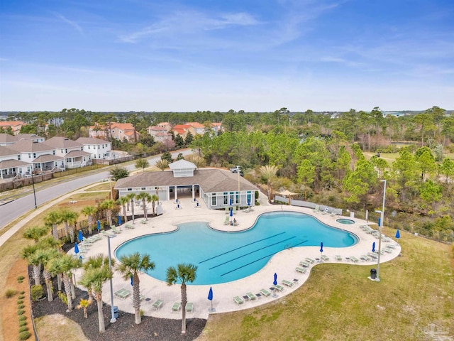 community pool featuring a patio area and fence