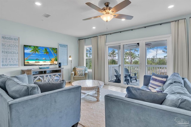 living area featuring ceiling fan, visible vents, wood finished floors, and recessed lighting