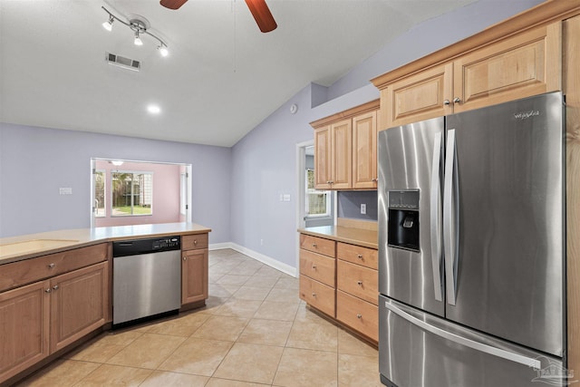 2759 Pleasant Bay Ct, Navarre, FL 32566 - kitchen featuring stainless steel appliances, vaulted ceiling, light countertops, ceiling fan, and light tile patterned floors
