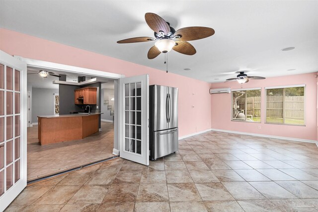 2759 Pleasant Bay Ct, Navarre, FL 32566 - kitchen with freestanding refrigerator, a wall unit AC, ceiling fan, a sink, and open floor plan