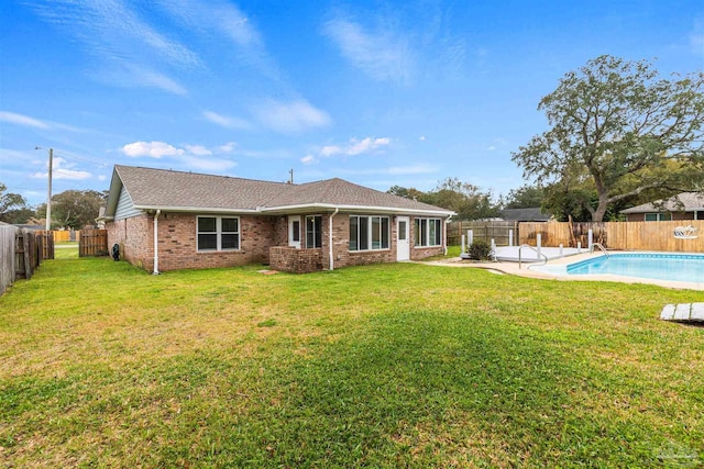 2759 Pleasant Bay Ct, Navarre, FL 32566 - rear view of property featuring brick siding and a shingled roof