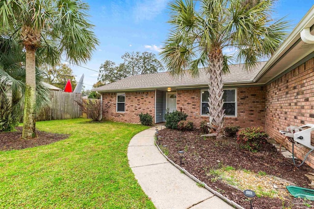 2759 Pleasant Bay Ct, Navarre, FL 32566 - property entrance featuring brick siding and roof with shingles