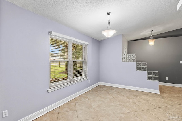 2759 Pleasant Bay Ct, Navarre, FL 32566 - tiled empty room with a textured ceiling and baseboards