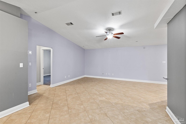 2759 Pleasant Bay Ct, Navarre, FL 32566 - empty room with a ceiling fan, light tile patterned flooring, baseboards, and lofted ceiling