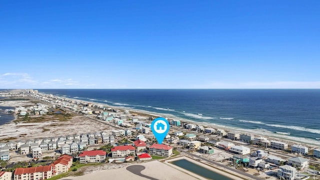 bird's eye view featuring a water view and a beach view