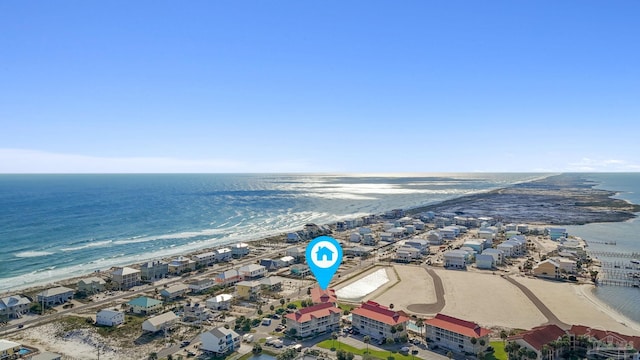 birds eye view of property featuring a water view and a view of the beach