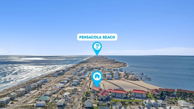 drone / aerial view featuring a water view and a view of the beach