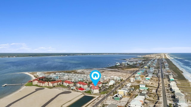 bird's eye view with a water view and a beach view