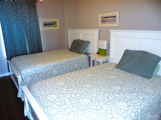 bedroom featuring dark wood-type flooring