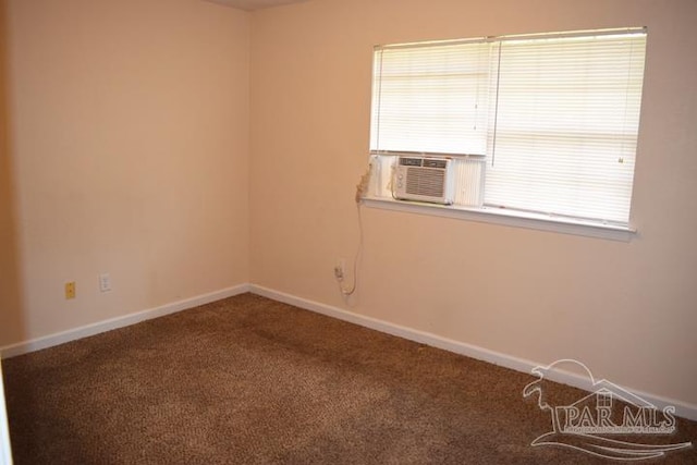 carpeted spare room featuring cooling unit