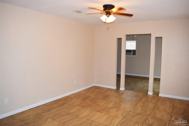 unfurnished room featuring ceiling fan and cooling unit