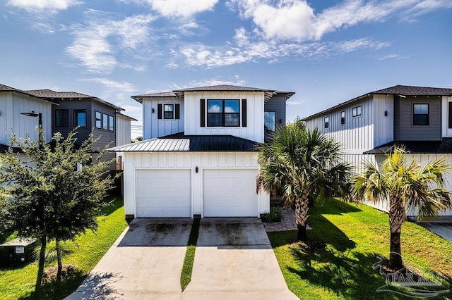 view of front of house with a garage and a front lawn