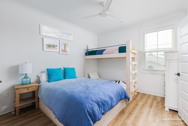 bedroom with light hardwood / wood-style flooring and ceiling fan