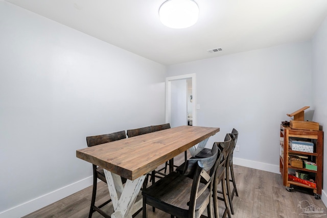 dining area featuring hardwood / wood-style flooring